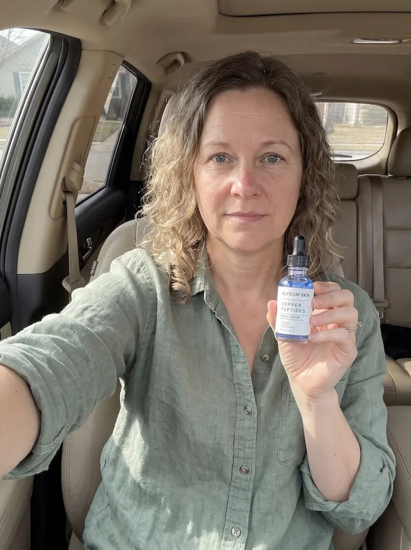 Elysium customer holding Copper Peptide Renewal Serum